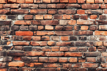 Old red brick wall background, wide panorama of masonry. Red brick laid in rows horizontally.