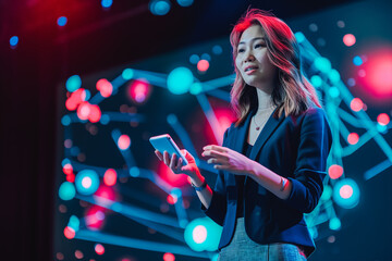 On-Stage Successful Female Speaker Presents Technological Product, Uses Remote Control for Presentation
