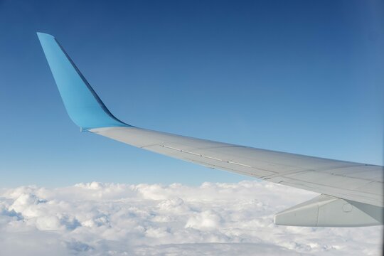 Aircraft Wing View From Airplane Window Seat Blue Sky Cloud