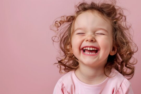 Naklejki Laughing and smiling Kid girl close up portrait isolated on pink background