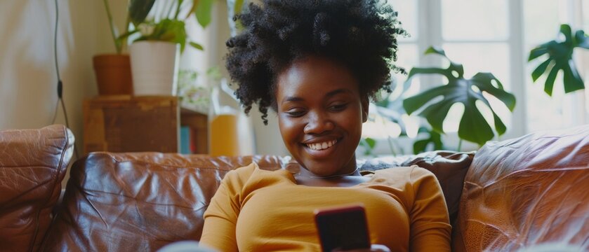 Smiling African Young Adult Woman Enjoying Social Media on Smartphone