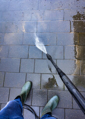 Spring cleaning of the pavement in the driveway of the house.
