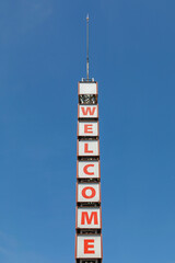 Welcome Message at Tall Column With Spire Lightning Rod - obrazy, fototapety, plakaty