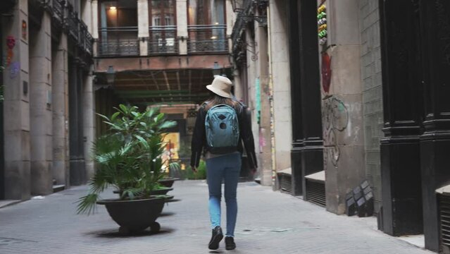 Woman visiting the neighborhoods of Barcelona.