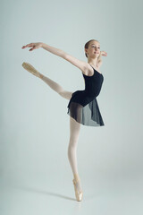 young teenage ballerina in a photo studio poses shows attitude