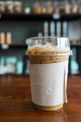 Ice coffee espresso cup in a plastic glass with brown tissue
