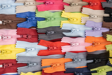 Multicolored Plastic Zippers or Zip Fasteners with sliders pattern for handmade sewing tailoring...