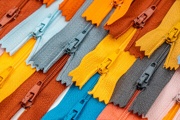 Multicolored Plastic Zippers or Zip Fasteners with sliders pattern for handmade sewing tailoring...