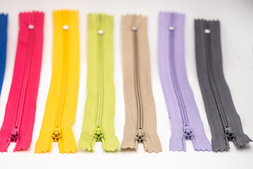 Multicolored Plastic Zippers or Zip Fasteners with sliders pattern for handmade sewing tailoring...