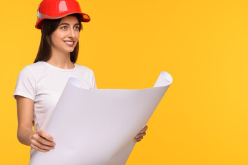 Architect in hard hat with draft on yellow background, space for text