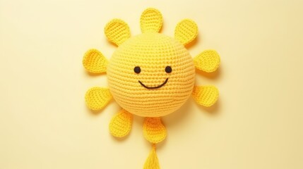 Knitted, cute sun with a smile on a yellow background, top view, with space for text. Greeting card, hobbies, knitting, children's toys.