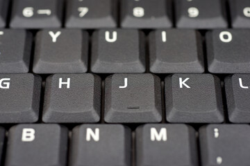 Close-up of the black keyboard of a laptop computer - 777171782