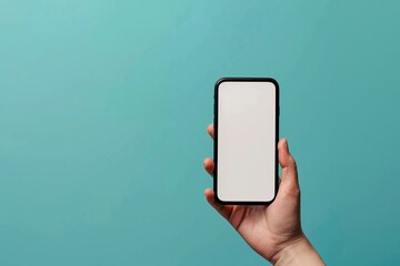 A hand presents a smartphone with a blank screen against a simple blue background