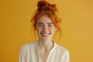 Joyful woman with ginger hair receives positive news  smiles happily. - obrazy, fototapety, plakaty