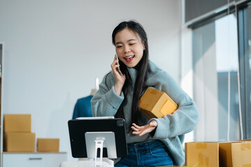 young woman work in back office for checking the product in the warehouse, concept e commerce.
