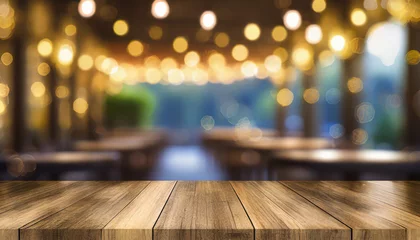Gartenposter empty wood table top on blur light gold bokeh of cafe restaurant in dark background © netsay