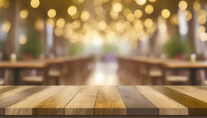Rucksack empty wood table top on blur light gold bokeh of cafe restaurant in dark background © netsay
