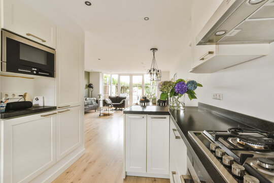 Modern kitchen intefaces seamlessly with living space
