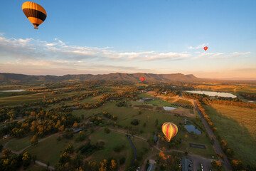 Hot air balloons in Pokolbin wine region over Vineyards from balloon aerial image, Hunter Valley, NSW, Australia	