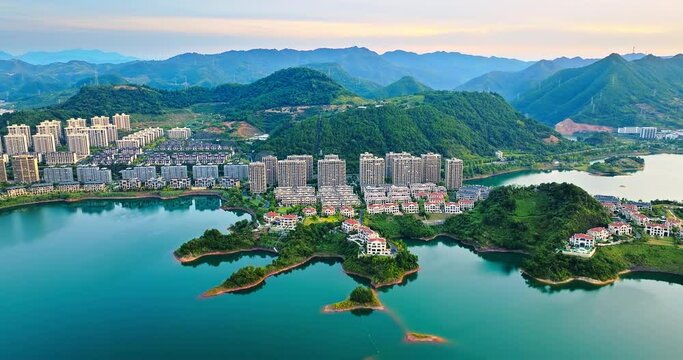 Aerial view of beautiful Qiandao Lake natural landscape with residential area buildings at dusk in Hangzhou