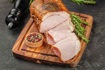Delicious ham, homemade cut ham on a wooden board, top view. copy space