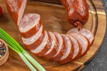 smoked sausage on a wooden background. top view. copy space