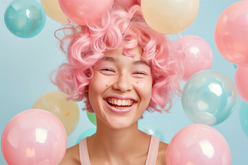 Surreal fashion photography of a happy laughing girl with pink hair. Colorful bubbles around the girl against a minimal pastel background. Magazine cover