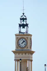 Fototapeta na wymiar Tower clock in Tarragona, marking accurate time, elegant and detailed structure under a clear sky.