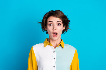 Photo of positive impressed lady dressed shirt open mouth big eyes isolated blue color background