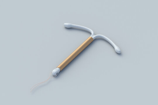 Birth control device on gray background. T-shape female contraceptive. Intrauterine device with coil. Sex education. Prevention method and contraception. Unwanted pregnancy. 3d render