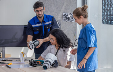 Innovative team including engineer, doctor and surgeon design robotic limbs for patient rehab.
