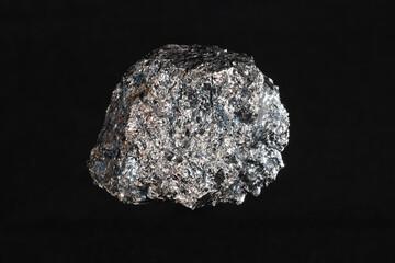 Ferrochromium (ferrochrome) piece on black background. Used for stainless steel production....