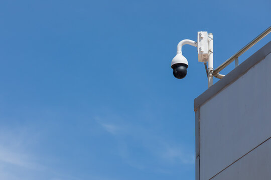 Urban Surveillance: Security Camera Monitoring Building Rooftop