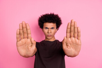 Closeup photo of aggressive young funny guy upset showing stop gesture two arms forbidden entrance...