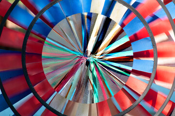 Slow motion photo of a spinning red, white, and blue pinwheel. Patriotic. Flag colors. Fourth of July