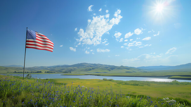 Large American flag waving proudly against a clear blue sky in landscape Memorial Day concept 4th of July 