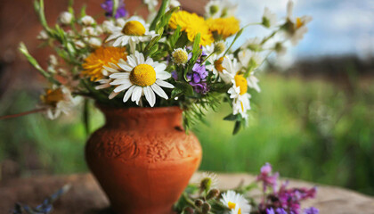 Naklejka na ściany i meble Flowers from the field in a clay vase. Spring motif. AI generative.