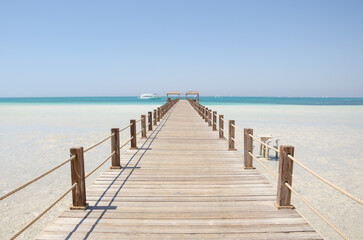 Wooden Pier at Orange Bay Beach coastline of Giftun island, Hurghada, Red Sea, Egypt.