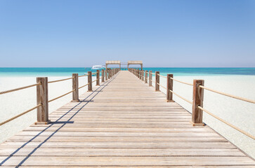 Wooden Pier at Orange Bay Beach coastline of Giftun island, Hurghada, Red Sea, Egypt.