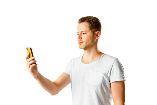 A man in a white t-shirt looking at his yellow phone, isolated on a white background, symbolizing modern communication