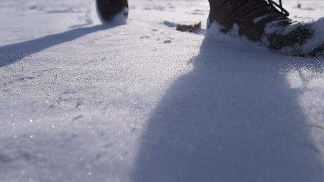 feet walking in deep snow shot in slow motion
