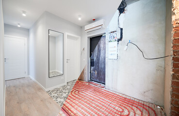 Old apartment with brick walls and new renovated flat with doors, mirror, air conditioner and...