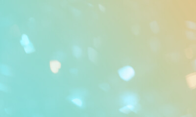 Luzes bokeh desfocadas luz iridescente sobre fundo colorido. Desfoques brilhantes. Verde, alaranjado. Fundo de tela, proteção de tela. Banner, site, apresentação. Tons pastéis.  Brilho, iluminado. - obrazy, fototapety, plakaty