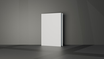 a blank white book in a dark room