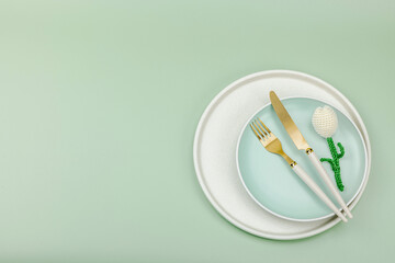 Minimalist spring table setting with crocheted tulip. Traditional festive symbol, greeting card