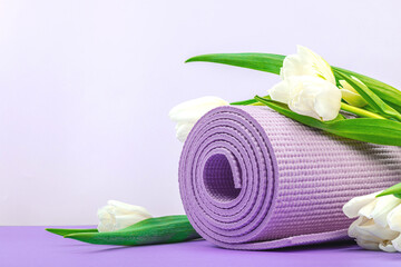 Yoga time concept. Traditional yoga mat, block and sticker. Healthy lifestyle, sport exercises