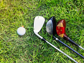 Golf equipment on green grass.