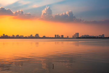 Skyline of Hanoi city, Vietnam on sunset over lake