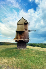 Old wooden mill. Authentic house in the vintage style. Installation in museums of traditional rural...