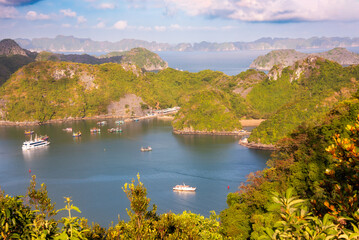 Sea landscape in Vietnam with many small islands and boats. View from above